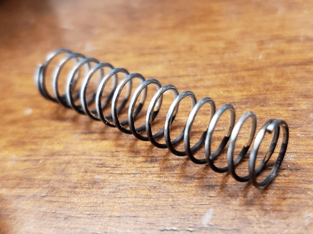 Reconnecting a longer compression spring